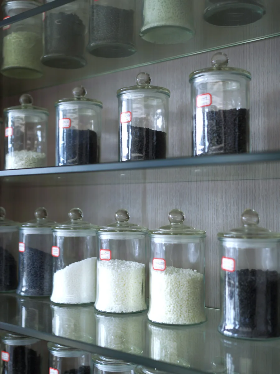 Modified plastic pellet samples in laboratory glass jars